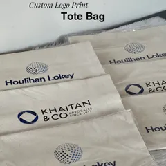 Custom logo printing on canvas tote bags for a corporate event. These bags served as the base for the gift hampers for clients Houlihan Lokey and Khaitan & Co.