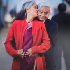 A tender kiss on the cheek, a gentle embrace from behind. This photo from their 50th-anniversary shoot is overflowing with a lifetime of love, care, and affection.