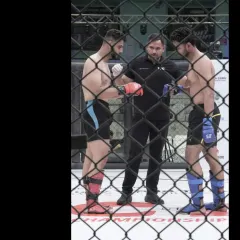 A pre-fight staredown overseen by our coach. His presence as a referee in promotions like VFC and MFN demonstrates his deep understanding of the rules and spirit of MMA.