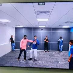 Leading a Tai Chi seminar for a corporate client. This gentle martial art is excellent for reducing stress and improving health.