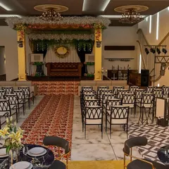 We design event venues that leave a lasting impression. This is a 3D visualization of a marriage hall masterpiece, featuring a grand stage, elegant seating arrangements for hundreds of guests, and a dedicated DJ console, all planned to ensure a seamless and luxurious event experience.
