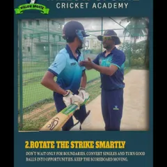 A coach gives a batsman personalized advice during a net session. We focus on smart strike rotation and keeping the scoreboard moving as key batting strategies.