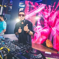 All smiles and a double thumbs-up from behind the decks. A great vibe and a happy crowd make for the best nights.