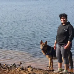 My partner sharing a moment with Jiraiya at the water's edge. My sessions are all about capturing the genuine connection you have with your pet in a relaxed, outdoor setting.