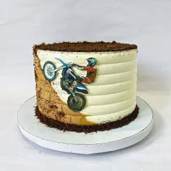 For the thrill-seeker, this dirt bike cake features an edible image of a rider in action against a backdrop of buttercream "dirt" and chocolate crumb soil. It's a great way to celebrate a love for motorsports.