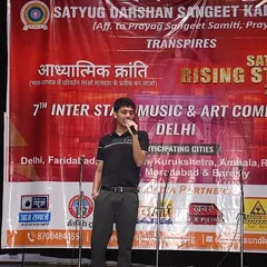 A student confidently takes the stage for his solo vocal performance. Our competition gives individuals a platform to shine and gain valuable stage experience in front of a live audience.