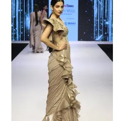 A side profile of the draped saree gown as it moves down the runway. This piece perfectly embodies my love for blending the grace of a saree with the structure of a modern gown.