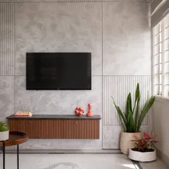 This living room features a custom floating media unit in oak and a feature wall with textured concrete panels. The design is a study in refined minimalism, where every element is both functional and beautiful.