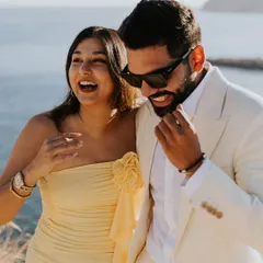 Laughter and joy, the best accessories for any outfit. This close-up captures the happy couple, with my client looking sharp and relaxed in his custom white suit.