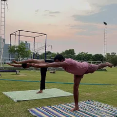 Holding a strong Warrior III pose (Virabhadrasana III), our members demonstrate balance and stability. This yoga asana strengthens the entire back side of the body.