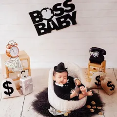 Another take on the 'Boss Baby' theme, this time with a tiny hat and a slightly different arrangement of props. I can customize these creative setups to your liking.