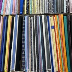 A close-up of the shirt and kurta fabrics I stock. You can see a wide variety of colors, prints, and checks to choose from.