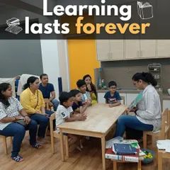 Here I am with a group of students and their parents, sharing a story that incorporates coding concepts. I believe learning is a community activity, and involving parents helps reinforce the lessons at home.