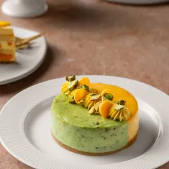 If summer had a flavor, it would be this Mango and Pistachio Cheesecake. The creamy, nutty pistachio base is the perfect complement to the sweet and tangy mango topping.