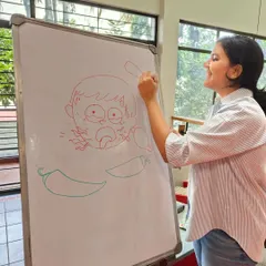 Illustrator Vibha Surya live-drawing a character from the book. This is one of my favorite parts of author events, as it shows kids the magic of how book characters come to life.