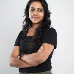 This headshot uses a classic crossed-arms pose to communicate confidence and expertise. The simple background and studio lighting ensure a sharp, professional look suitable for any corporate or business use.