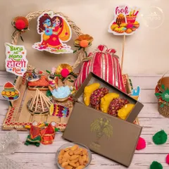 This beautiful Holi hamper features a box of my signature fusion gujiyas, almonds, and other treats, all decorated with cute Radha-Krishna and Holika Dahan cutouts.