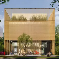 The full facade of the Hyderabad mixed use building. The main volume is wrapped in a fine golden mesh, with a rooftop terrace and greenery. It is a contemporary, minimalist structure that still feels bold and confident.