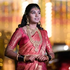 I styled this bride for her reception in a stunning traditional temple jewellery set. The layered necklaces and matching earrings in an antique gold finish perfectly complemented her beautiful pink silk saree.