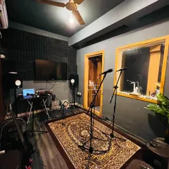 This is one of our professionally treated recording and jamming rooms. It's fully equipped with studio monitors, microphones, and a comfortable setup, creating the perfect vibe for you to practice and create.