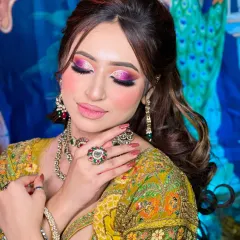 A detailed shot of a vibrant mehendi eye makeup. I used a blend of pink, purple, and shimmer to create this festive and colorful look.