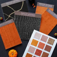 We love curating palettes for every occasion, even Halloween. This flat lay for Phillip Jeffries showcases a range of textures, from bold orange weaves to faux crocodile leather, demonstrating the versatility and creativity of our collections.