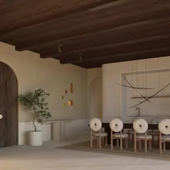 The dining area of our CAN BENET project in Ibiza, designed in collaboration with Gabriela Puig Soleille. The space is defined by natural materials, including a dark wood ceiling and an arched doorway, creating an atmosphere of rustic, understated luxury.
