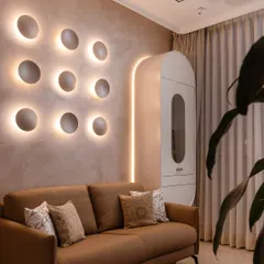 Lighting is jewelry for the home. This sculptural wall installation is a perfect example. During the day, it's a piece of art; at night, it casts a soft, ambient glow, transforming the entire mood of the room with quiet drama.