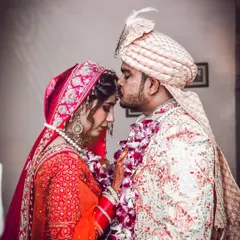 A tender moment on the wedding day. The groom's gentle kiss on the bride's forehead is a classic shot that I love to capture, as it speaks volumes about their love and care for each other.