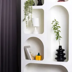 A detailed view of our styled arched shelves, showing how various props like vases, books, and plants can be arranged to create a personalized and aesthetic background.