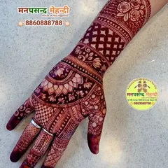 The rich, dark stain of this finished henna design is proof of my 100% color guarantee. The intricate floral and paisley patterns show beautifully against the skin.