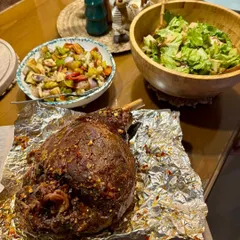A centerpiece for any celebration, our Karthakaad ham leg. The pork is marinated and slow-cooked in a glaze of mixed citrus, honey, and peppers, all sourced from our estate in Coorg, creating a tender and flavorful roast.