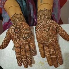 An example of a full bridal mehendi design covering both palms, created with my henna cones. The pattern is dense and traditional, featuring classic motifs perfect for a wedding ceremony. The dark, even stain demonstrates the quality you can expect for significant events.