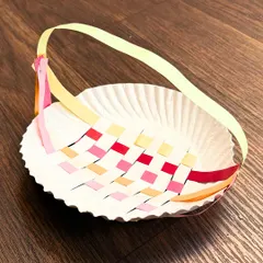 This woven paper plate basket is a great example of how we use everyday materials to teach crafting techniques. Students learn about weaving and construction while making a beautiful and functional item to take home.