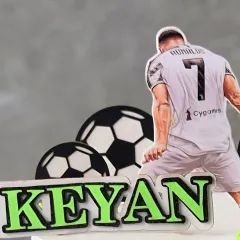 A detail shot of the Ronaldo-themed cake, personalized with the name 'Keyan'. Perfect for a young football enthusiast.