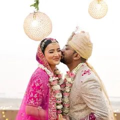 A sweet kiss on the cheek under the floral mandap. These are the tender, unscripted moments that I love to capture during the wedding ceremony.