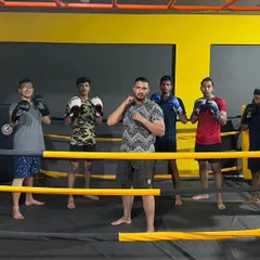 Posing with some of my fighters in the ring. I'm proud of the progress each one of them makes.