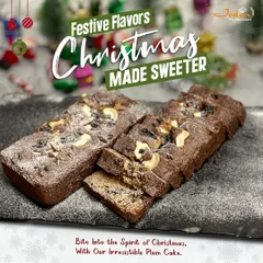 Experience the taste of Christmas with our classic plum cake. This image captures two rich, dark fruit cakes, generously topped with cashews and dusted with powdered sugar, promising a moist, flavorful bite that embodies the holiday spirit.