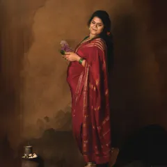Draped in a rich red Mysore silk saree, this mom-to-be embodies grace. I style these traditional shoots to highlight cultural details, from the floral hair adornments to the fine jewelry, creating an image of timeless elegance.