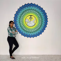 This large-scale fetus mandala was a special project for a fertility hospital in Bangalore. Standing next to the finished piece shows the impressive size and intricate detail involved in creating a powerful, meaningful centerpiece for a space.