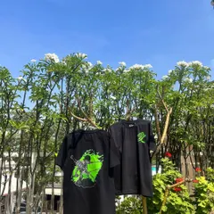 Here are the two custom anime T-shirts hanging outdoors, giving you a clear view of the front and back designs in natural light. The quality of the print ensures the design is sharp and long-lasting.