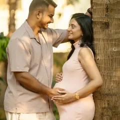 A relaxed and happy portrait by a tree. The natural setting provides a beautiful, serene backdrop for capturing your love story.