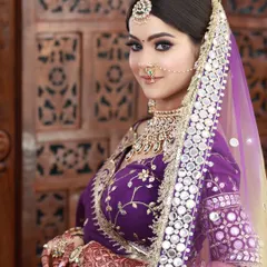 I love working with unconventional colors. For this bride, we chose a striking purple lehenga and created a soft glam makeup look with defined eyes and a nude lip to balance the vibrant outfit.