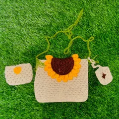 My signature crochet sunflower sling bag set. This three-piece combo includes the main bag, a matching small pouch, and a tiny charm, all handcrafted with durable yarn.