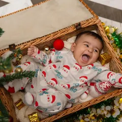 That full-body, open-mouthed laugh of a happy baby is one of the most precious things in the world. I use simple props like this wicker basket to create a safe and playful space for your little one to be themselves during our session.