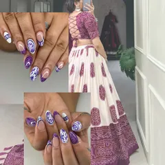 Get ready for Garba with gorgeous nails to match your outfit. This client wanted a design to match her purple and white lehenga, so we created this beautiful traditional pattern.