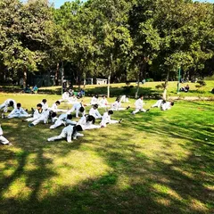 More of our students working on their flexibility during the belt test at Nehru Park. We take advantage of open spaces for large group training.