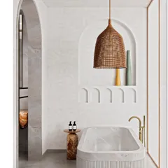 Another view of the serene bathtub nook, where a fluted marble tub and a natural fiber pendant light create a spa-like atmosphere.