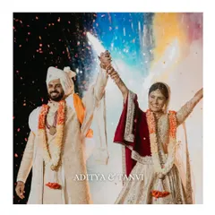 The moment of union, bursting with color and energy. We love capturing the peak of the celebration, like this vibrant varmala moment, where joy is so palpable you can almost feel the confetti and hear the cheers.