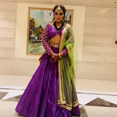 Bringing the bridesmaid glow to life. I styled myself in this stunning purple lehenga with a contrasting green chunni for a wedding function. It's an elegant and eye-catching look perfect for a bridesmaid.